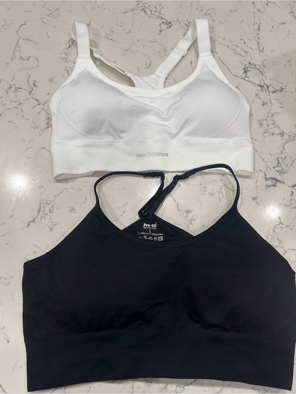 Two sports bras - New Balance White & Pro-fit Black